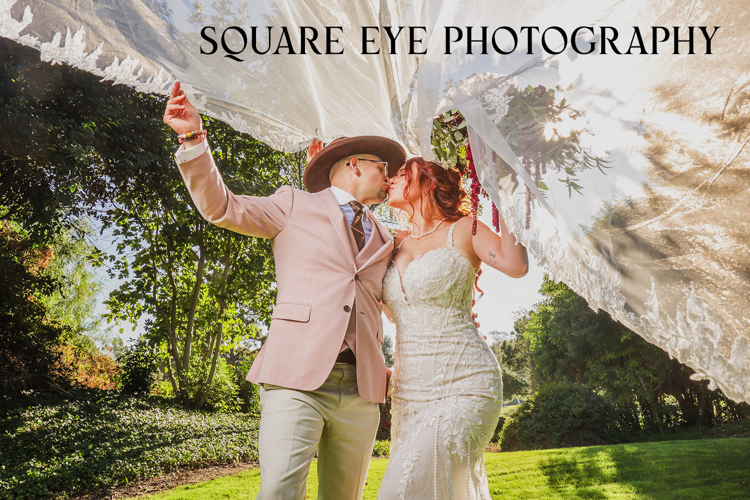 BRIDE-AND-GROOM-WEDDING-COUPLE-UNDER-FLYING-VEIL BRIDE-AND-GROOM-WEDDING-COUPLE-UNDER-FLYING-VEIL