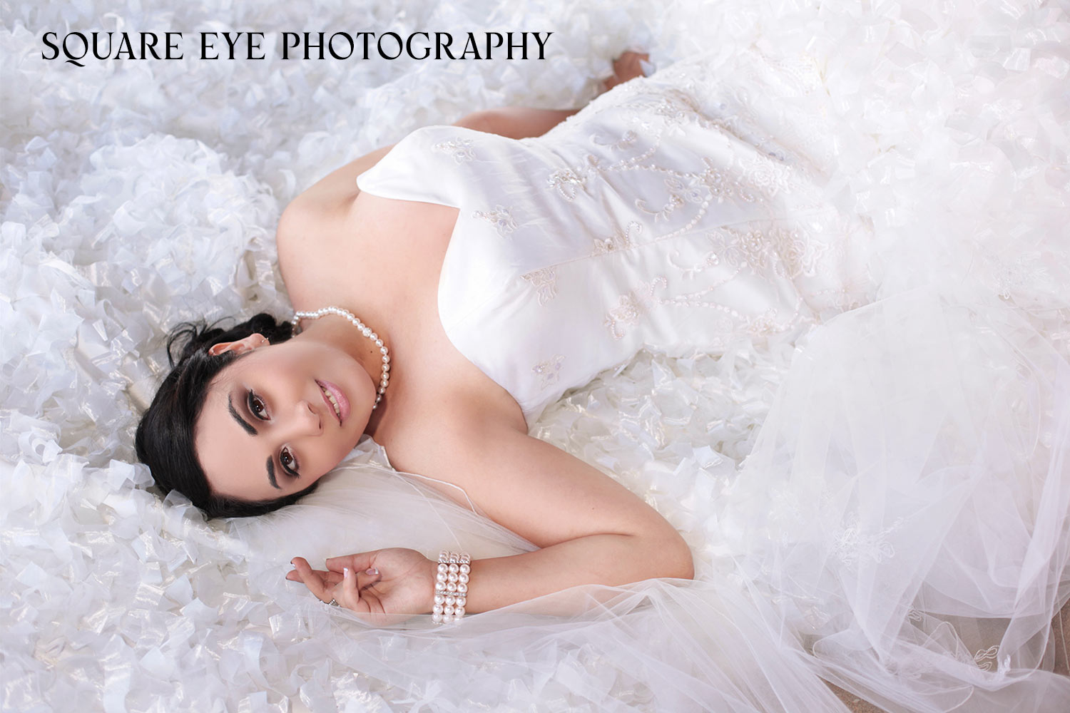 BRIDE-LAYING-ON-FLOOR-ON-VEIL Bride-laying-down-on-stairs-on-her-cathedral-veil