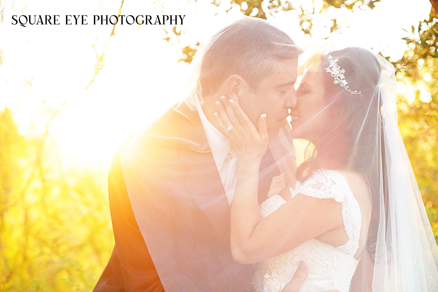 bride-and-groom-kissing-under-cathedral-viel bride-and-groom-kissing-under-cathedral-viel