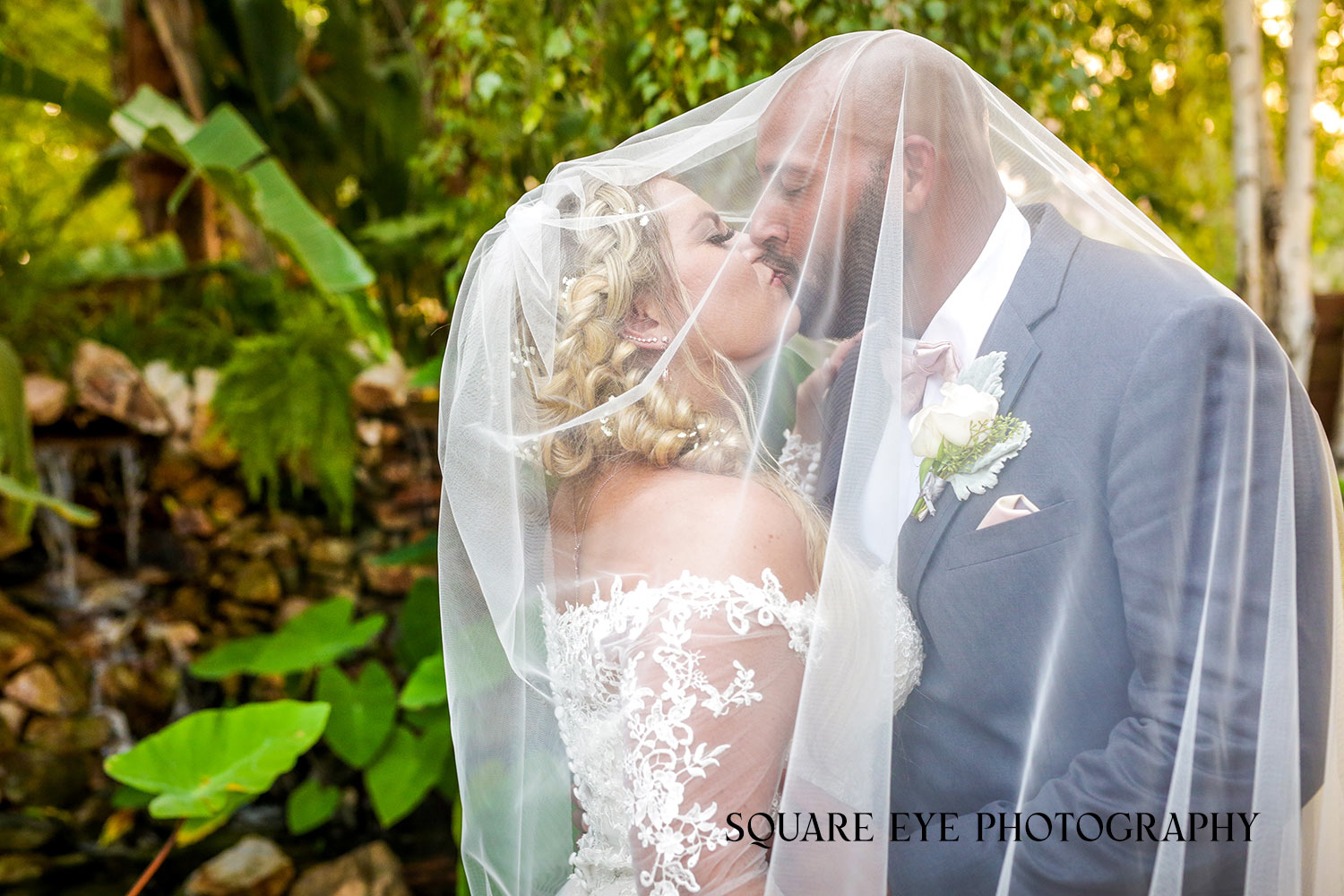 bride-and-groom-kissing-under-veil-pose bride-and-groom-kissing-under-veil-pose