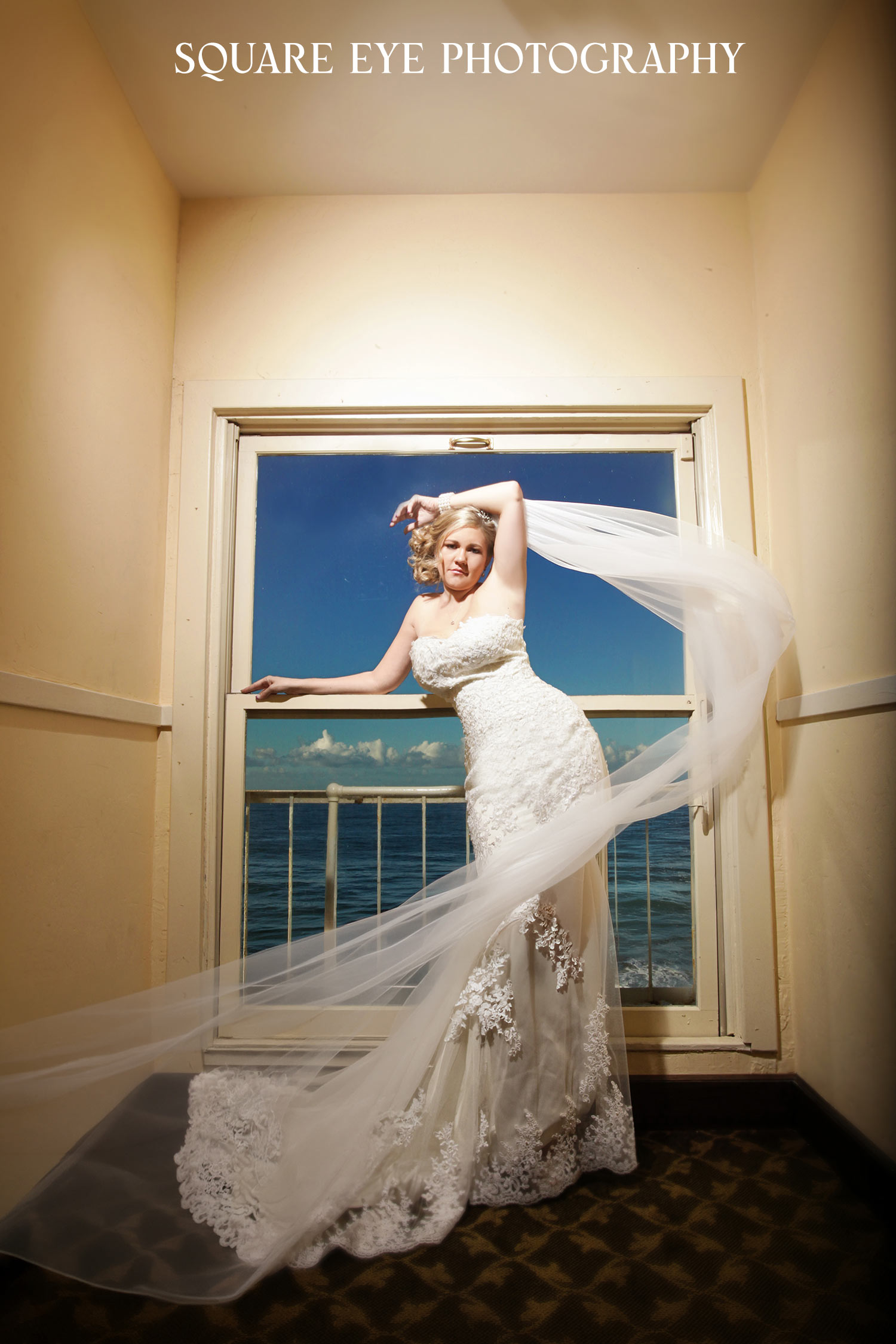 cathedral-veil-sunset-wedding-photos-04 Cathedral veil wedding photos of a bride with her long veil lifted against the sunset, photographed by Square Eye Photography